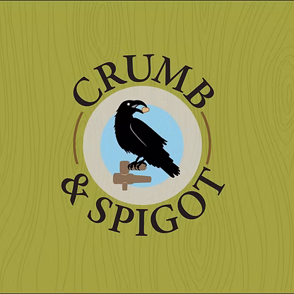 A black bird holding a crumb sits on a spigot, centered in a circular frame with the text "CRUMB & SPIGOT" on a green wood-textured background.